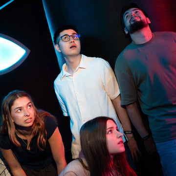Group reacting to immersive interactive game experience at Power Play Sydney venue