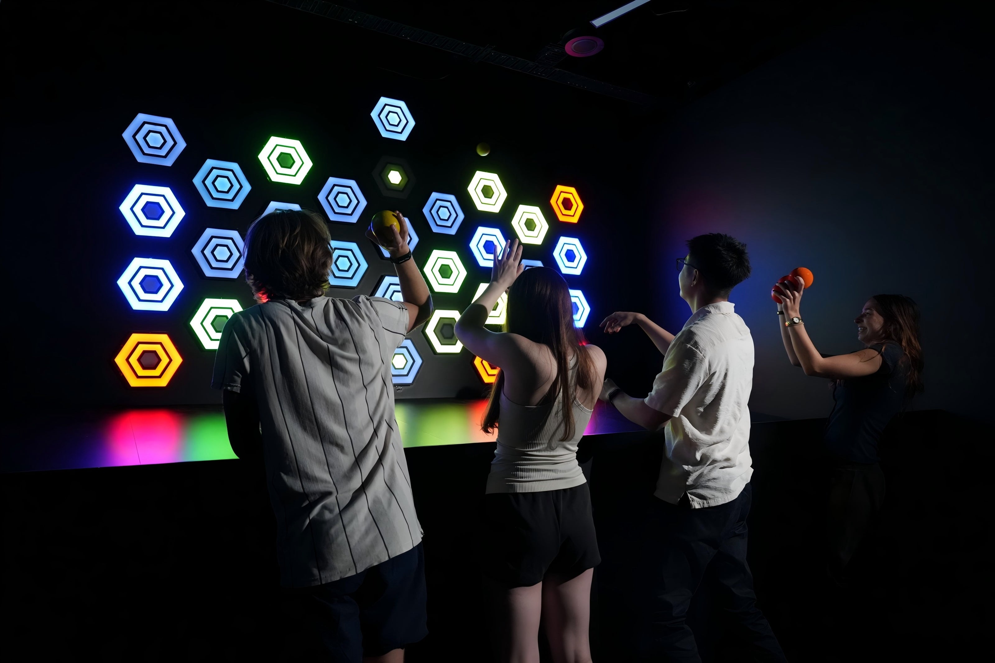People playing interactive throw game at Power Play Sydney indoor activities venue